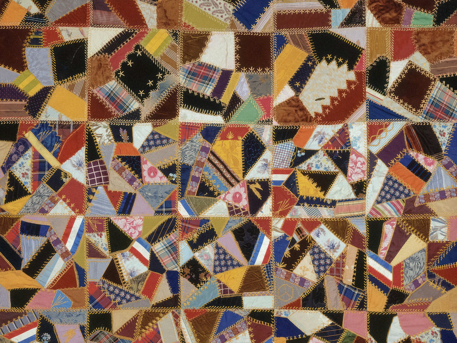Detailed multicolour crazy quilt with decorative stitching